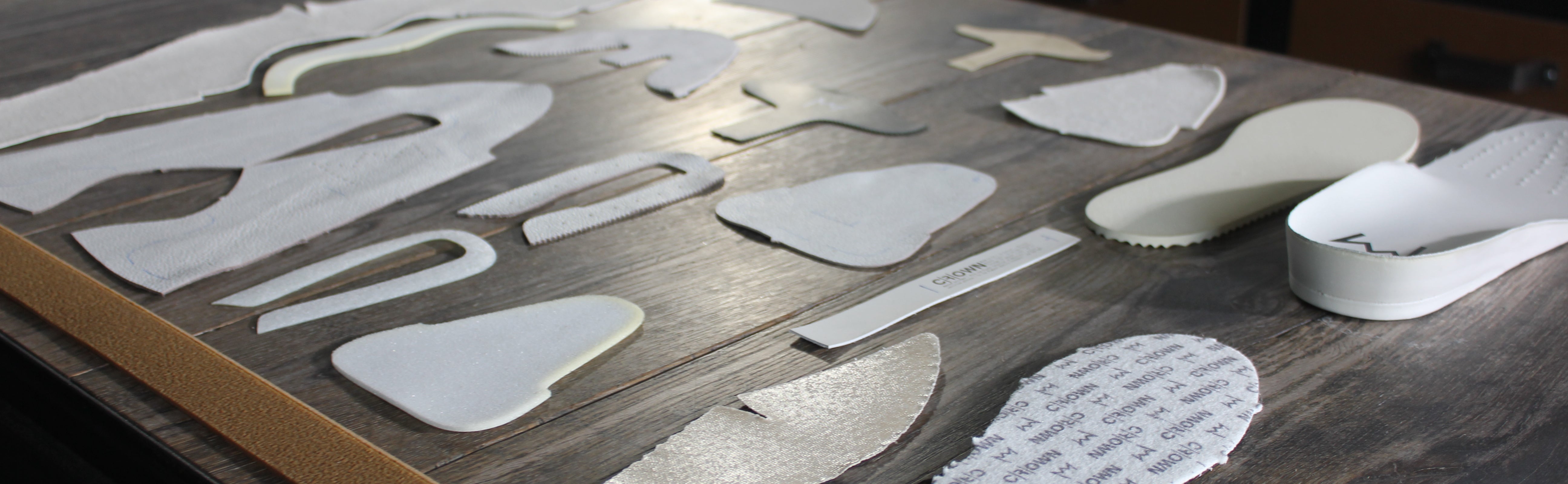 All elements that create a sneaker laid out flat on a table.