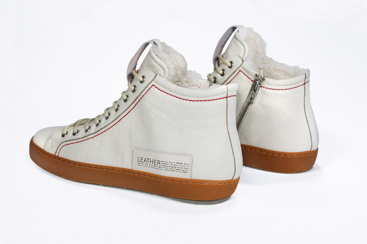  Women's ORIGINAL LC17 Fur-lined High-top in White Leather sneaker, with signature red stitching and a natural rubber sole.