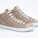 Three quarter front view of mid top cuoio sneaker with full suede upper with perforated crown logo and white sole.