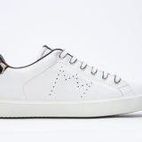 Side profile view of low top white sneaker with leopard print detailing and perforated crown logo on upper. Full leather upper and white rubber sole.