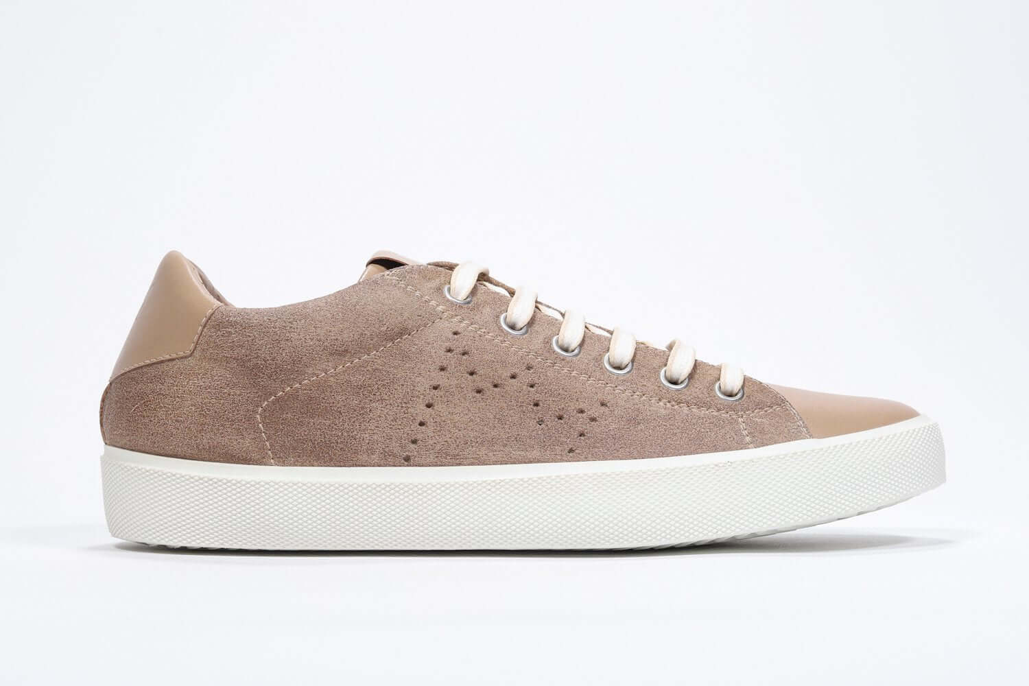 Side profile of low top cuoio sneaker with perforated crown logo on upper. Full suede upper and white rubber sole.