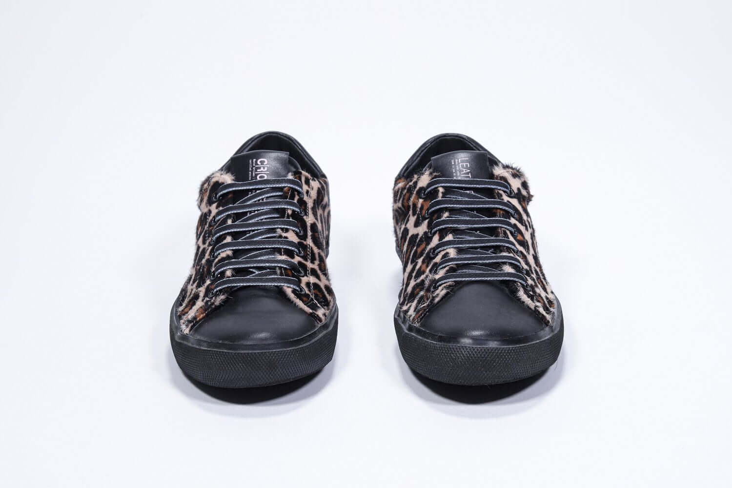 Front view of low top leopard print sneaker. Full haircalf leather upper and black rubber sole.